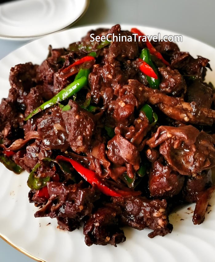 Duck with blood rice cake traditional Tujia cuisine